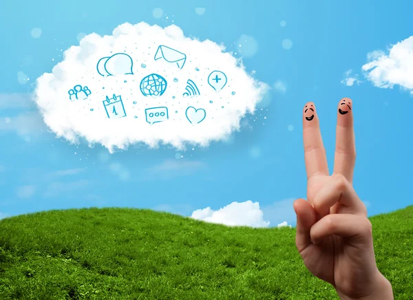 Glückliche Smiley-Finger, die auf Wolke mit blauen sozialen Symbolen schauen und — Stockfoto