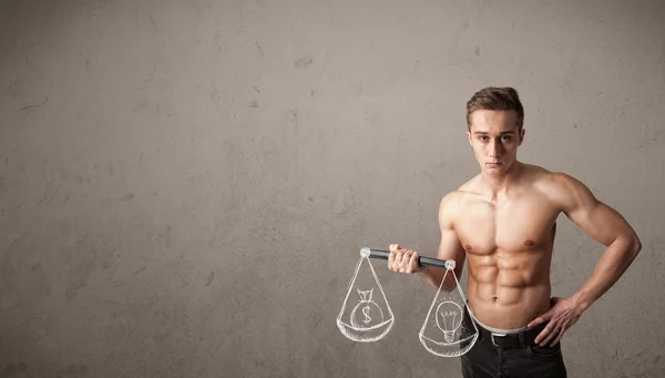Muscular man trying to get balanced — Stock Photo, Image