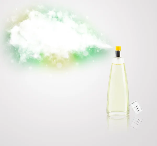 Beautiful bottle spraying colorful cloud — Stock Photo, Image