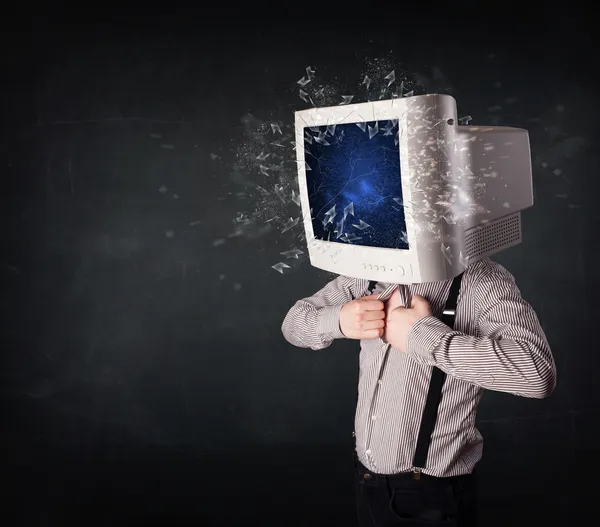 Computer monitor screen exploding on a young persons head — Stock Photo, Image