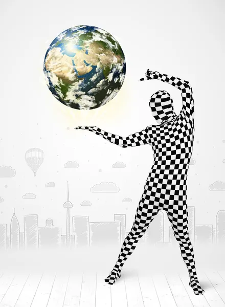 Man in full body suit holding planet earth — Stock Photo, Image