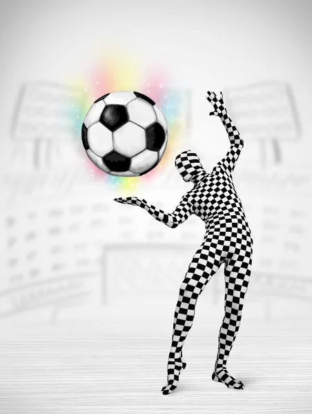 Man in full body suit holdig soccer ball — Stock Photo, Image