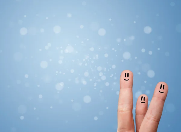 Feliz dedo emoticonos con fondo bokeh azul vacío — Foto de Stock