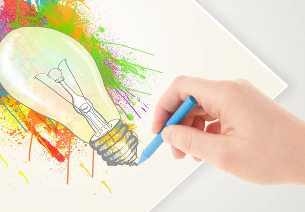 Hand drawing on paper a colorful splatter lightbulb — Stock Photo, Image