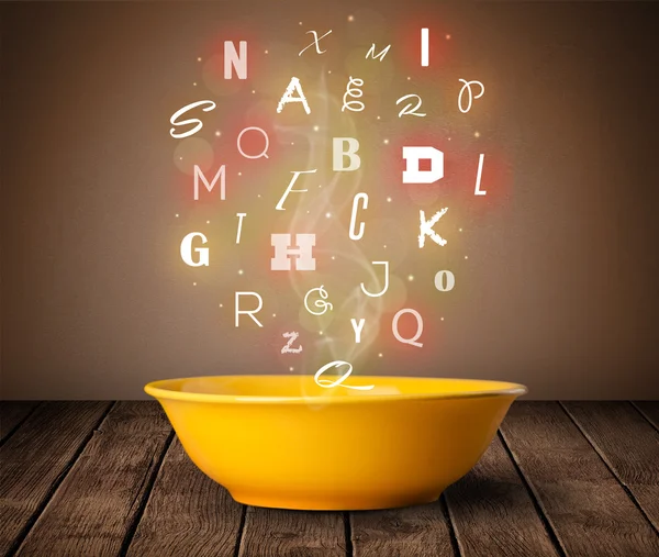 Colorful letters coming out of home cook soup bowl — Stock Photo, Image