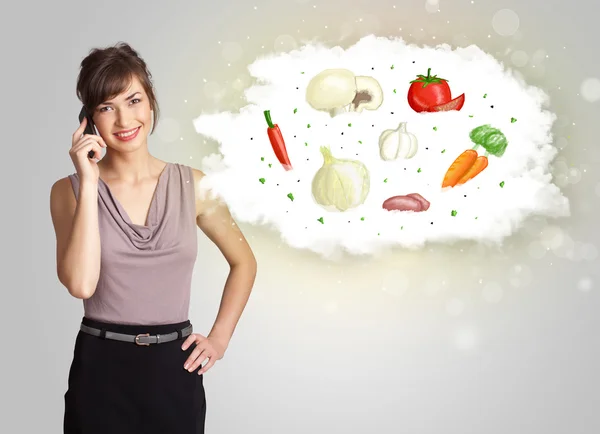 Mujer bonita presentando una nube de vegetales nutritivos saludables —  Fotos de Stock