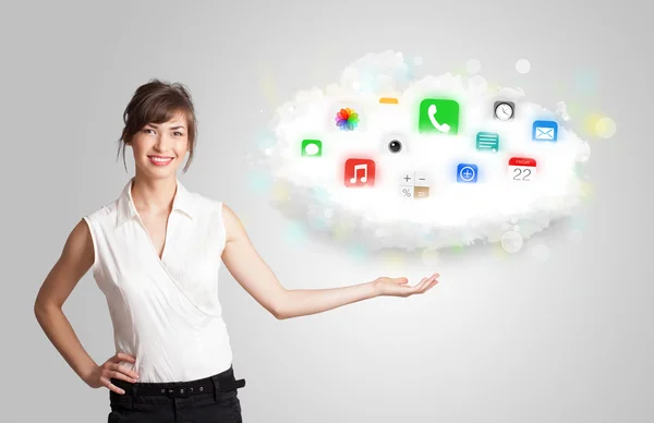 Young woman presenting cloud with colorful app icons and symbols — Stock Photo, Image