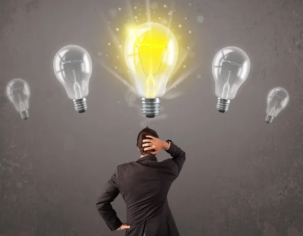 Business person having an idea light bulb concept — Stock Photo, Image