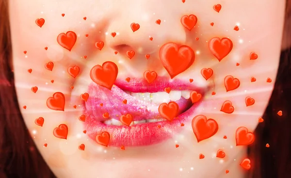 Pretty lady lips with lovely red hearts — Stock Photo, Image