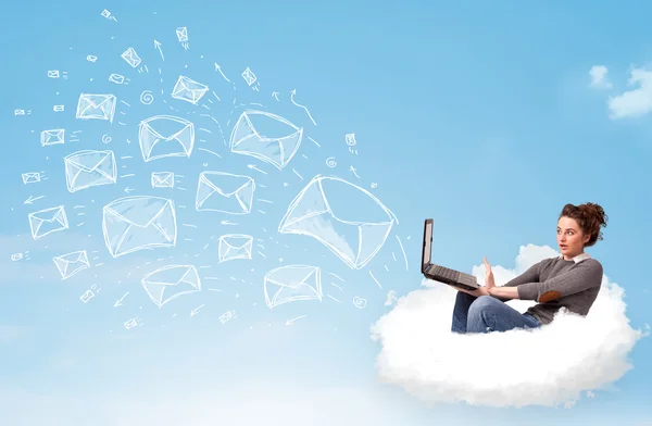 Young woman sitting in cloud with laptop — Stock Photo, Image