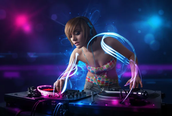 Disc jockey playing music with electro light effects and lights — Stock Photo, Image