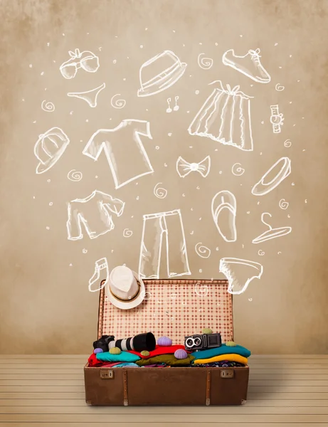 Traveler luggage with hand drawn clothes and icons — Stock Photo, Image