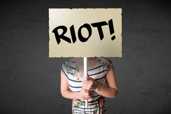 Young woman holding a protest sign — Stock Photo, Image