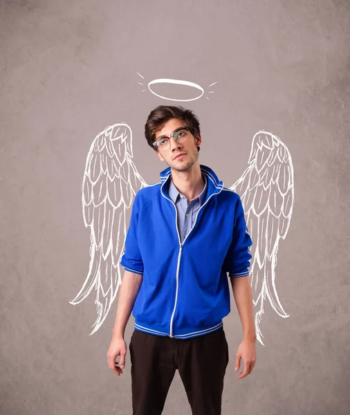 Young man with angel illustrated wings — Stockfoto