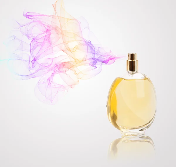 Butelka perfum rozpylanie kolorowy zapach — Zdjęcie stockowe