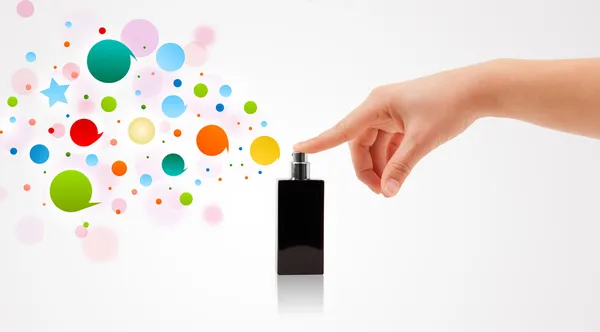 Woman hands spraying colorful bubbles — Stock Photo, Image