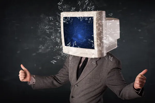 Computer monitor screen exploding on a young persons head — Stock Photo, Image