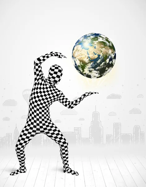 Man in full body suit holding planet earth — Stock Photo, Image