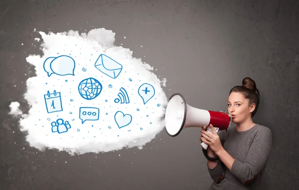 Woman shouting into loudspeaker and modern blue icons and symbol — Stock Photo, Image