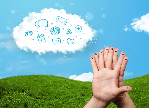 Happy smiley fingers looking at cloud with blue social icons and — Stock Photo, Image