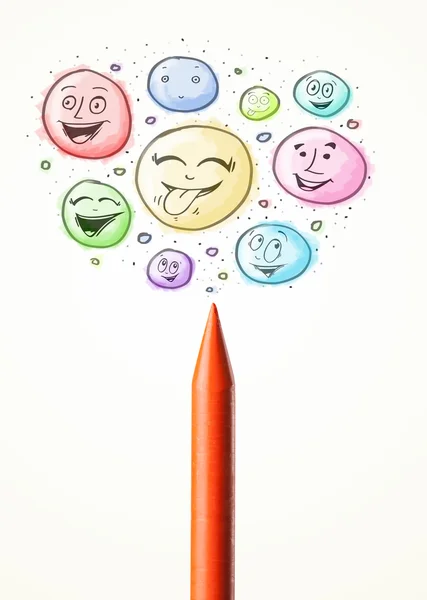 Smiley faces coming out of crayon — Stock Photo, Image