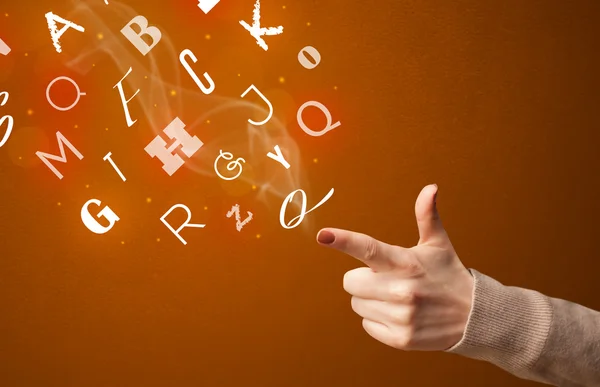 Letters coming out of gun shaped hands — Stock Photo, Image