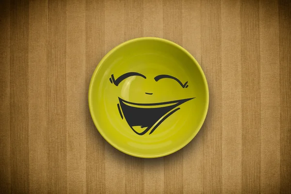 Glad smiley tecknad ansikte på färgglada skålen platta — Stockfoto