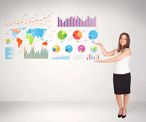 Business woman with colorful graphs and charts — Stock Photo, Image