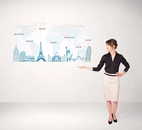 Business woman presenting map with famous cities and landmarks — Stock Photo, Image