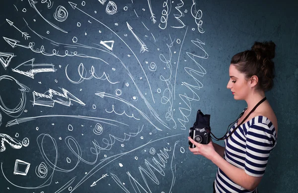 Photographer shooting images while energetic hand drawn lines an — Stock Photo, Image