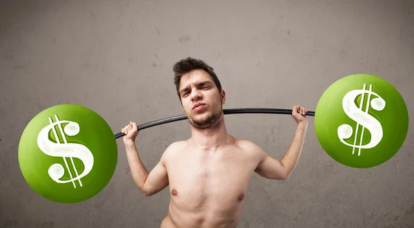 Skinny guy lifting green dollar sign weights — Stock Photo, Image