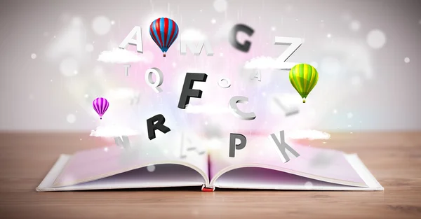 Open book with flying 3d letters on concrete background — Stock Photo, Image