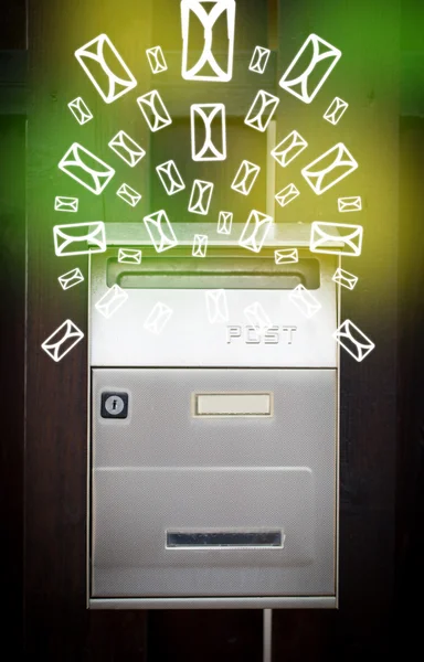 Mailbox with letter icons on glowing green background — Stock Photo, Image