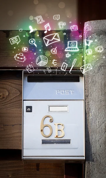 Colorful icons and symbols bursting out of a mailbox — Stock Photo, Image