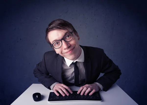 Hacker working with keyboard on blue background — Stock Photo, Image