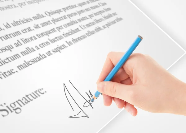 Hand writing personal signature on a paper form — Stock Photo, Image