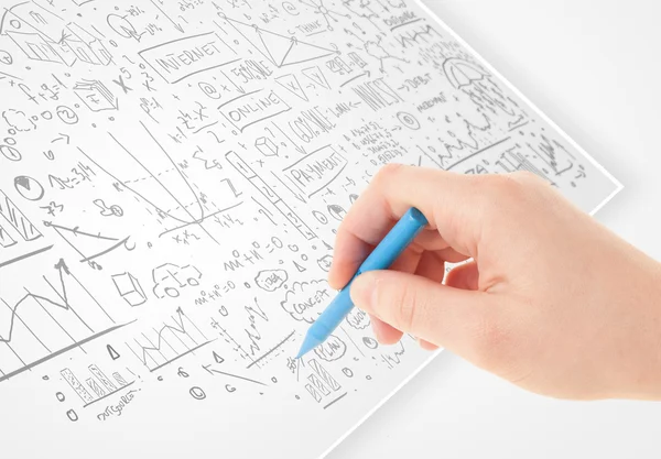 Human hand sketching ideas on a white paper — Stock Photo, Image