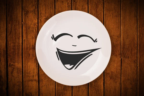 Happy smiley cartoon face on colorful dish plate — Stock Photo, Image