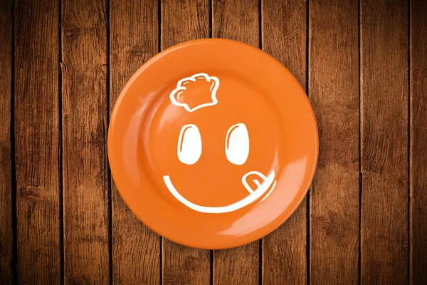 Cara de dibujos animados sonriente feliz en plato colorido —  Fotos de Stock