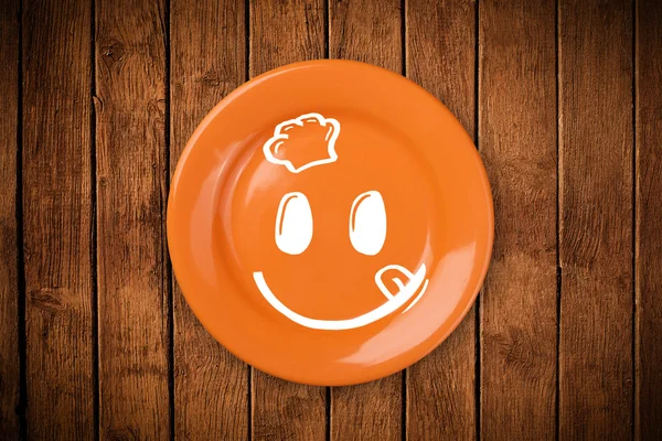 Happy smiley visage de dessin animé sur plaque de plat coloré — Photo