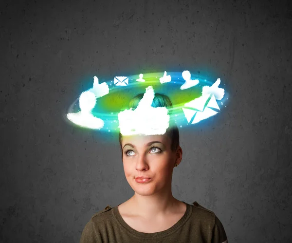 Young teenager with cloud social icons around her head — Stock Photo, Image