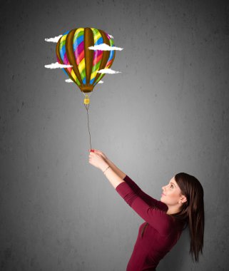 bir balon çizim tutan kadın