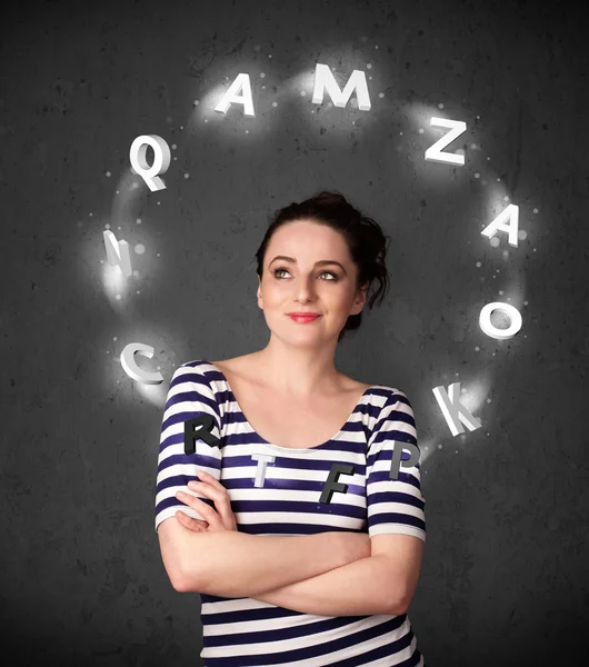 Young woman thinking with letter circulation around her head — Stock Photo, Image