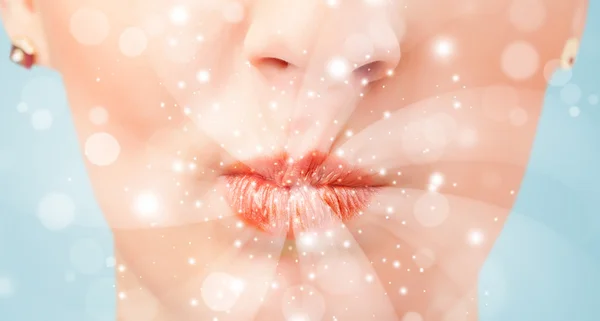 Vacker kvinna läppar blåser abstrakt vita lampor — Stockfoto