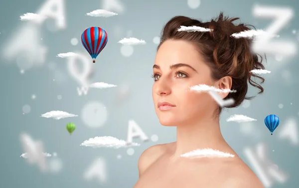 Beautiful young woman with wellness and healthcare clouds — Stock Photo, Image