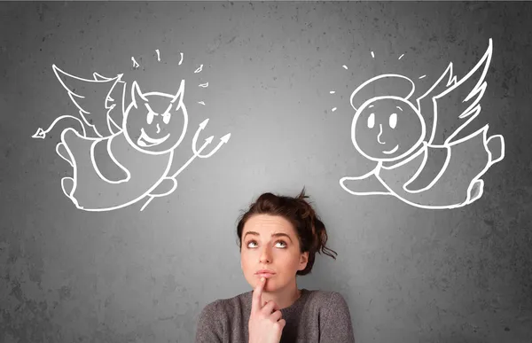 Woman standing between the angel and the devil — Stock Photo, Image