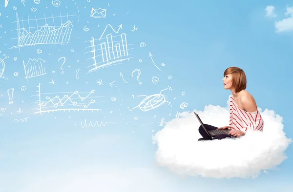 Young woman sitting in cloud with laptop — Stock Photo, Image