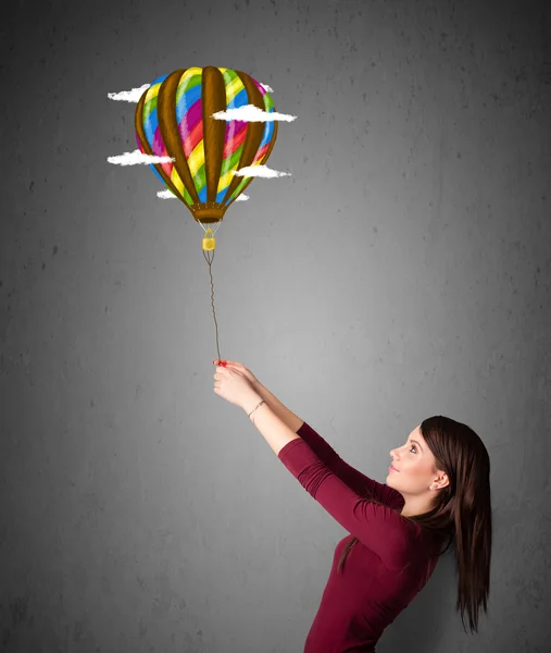 Mujer sosteniendo un dibujo en globo — Foto de Stock