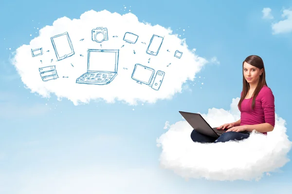 Young woman sitting in cloud with laptop — Stock Photo, Image