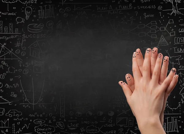 Happy finger smileys with black chalkboard in background — Stock Photo, Image